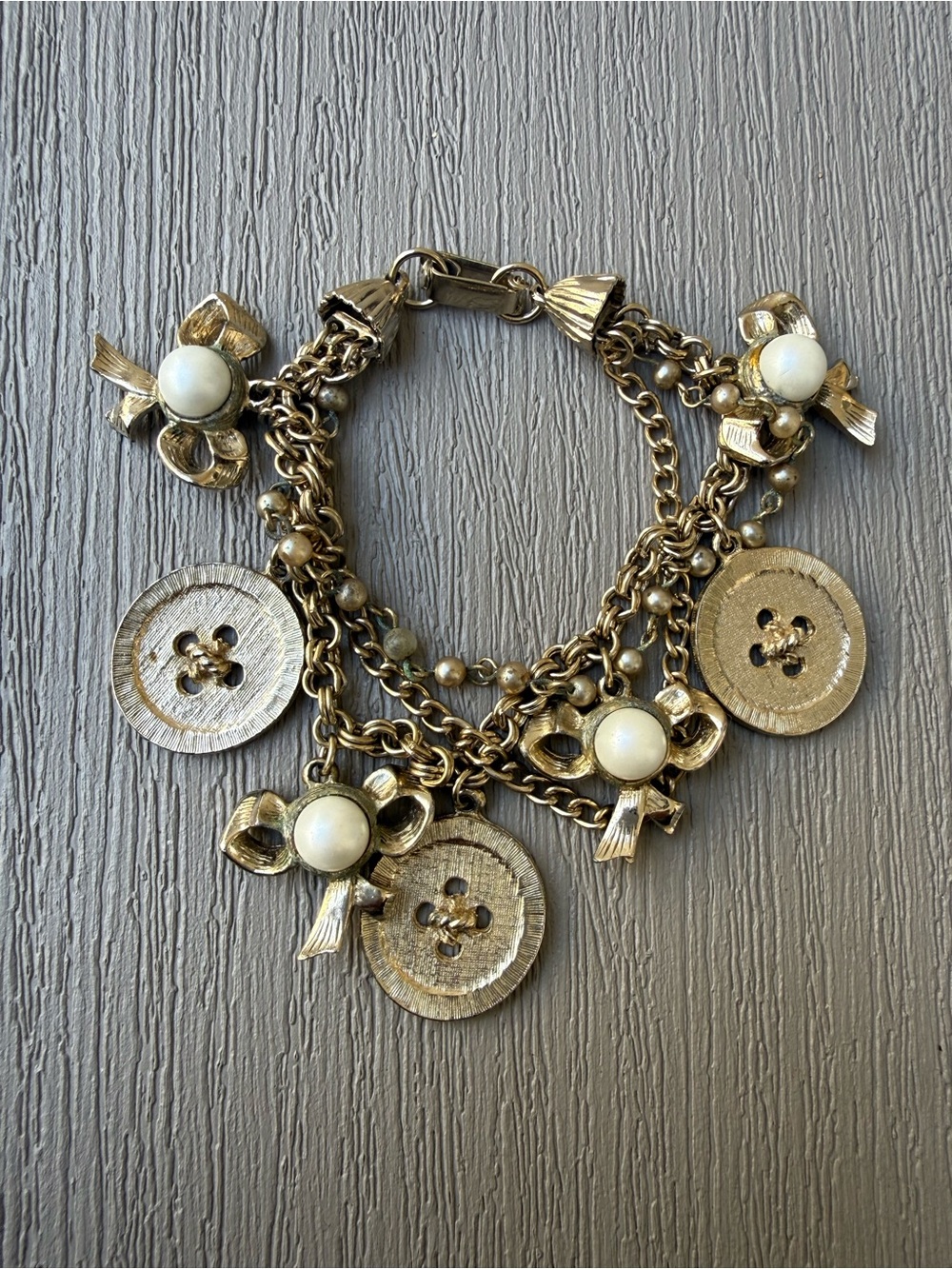 Vintage Gold Tone Charm Bracelet Buttons Bows Faux Pearls Multi Chain